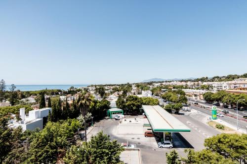 an overhead view of a gas station in a city at Guadalpin Suites in Marbella