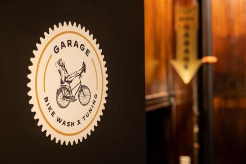 a sign for a bicycle museum with a person riding a bike at Traveler's Rest Hotel in Pittsburgh