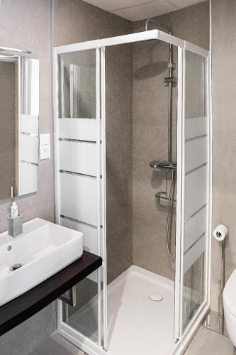 a bathroom with a shower and a sink at Blue Sunset Manilva in Manilva