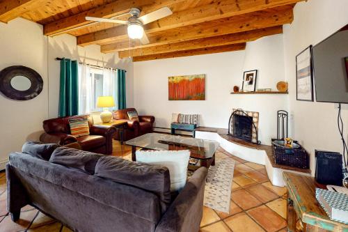 a living room with a couch and a table at Kathryn Place Casita in Santa Fe