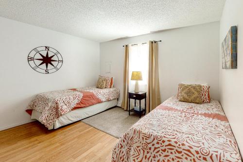 a bedroom with two beds and a window at Kathryn Place Casita in Santa Fe