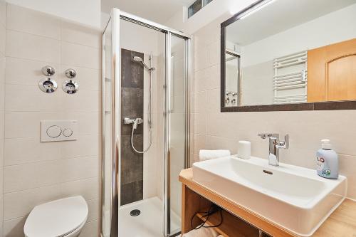 a bathroom with a sink and a shower at Ferienwohnung Allegra in Reit im Winkl