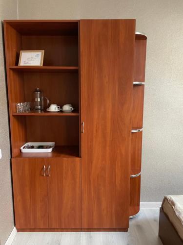 a wooden book shelf with a radio in it at Львівський in Lviv