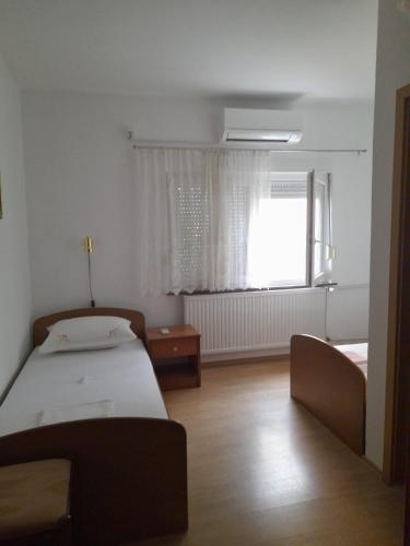 Postel nebo postele na pokoji v ubytování MIR