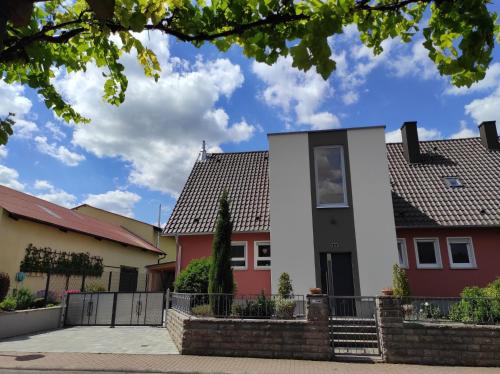 a house with red and white houses at Ferienwohnung an der Klinge in Wiesenbronn