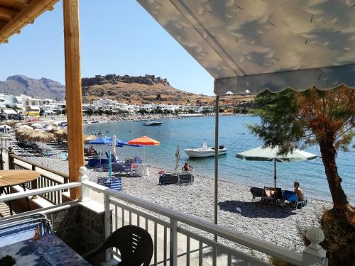 a view of a beach from a balcony at Stamatia's House in Haraki