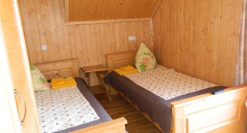 Tempat tidur dalam kamar di U Stozi Hotel