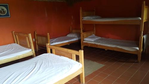 a group of bunk beds in a room at Hacienda Yanahurco in Del Salitre