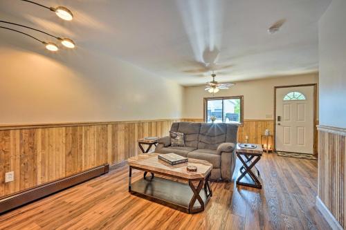 a living room with a couch and a table at Updated Bolton Home with Fire Pit! in Bolton