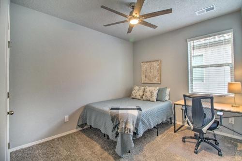 a bedroom with a bed and a desk and a window at Family-Friendly Rio Rancho Home Near Old Town in Rio Rancho