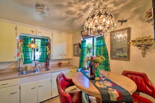 a kitchen with a table and chairs and a sink at Walk to Old Town Arvada - 1940 Vintage Bungalow! in Arvada