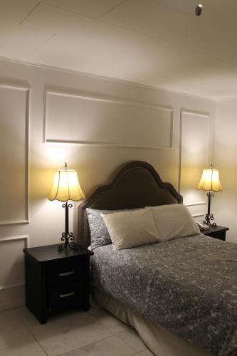 Postel nebo postele na pokoji v ubytování Sage Hills Motel