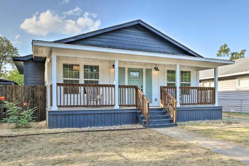 a home with a blue house with a porch at Charming San Antonio Home about 4 Mi to Downtown in San Antonio