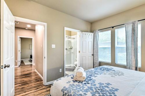 a bedroom with a bed and a large window at Charming San Antonio Home about 4 Mi to Downtown in San Antonio