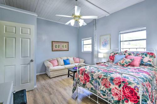 a bedroom with a bed and a couch at Secluded Weatherford Cottage with Outdoor Pool! in Willow Park