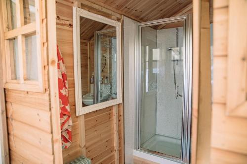 a room with two glass windows in a house at Appleblossom Yurt in Alkborough