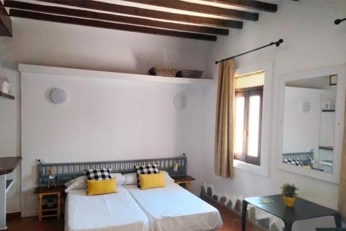 Ένα ή περισσότερα κρεβάτια σε δωμάτιο στο LEON DORMIDO Rooms & Apartments