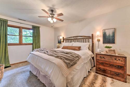 a bedroom with a bed and a ceiling fan at Maggie Valley Townhome In Smoky Mountain Foothills in Maggie Valley