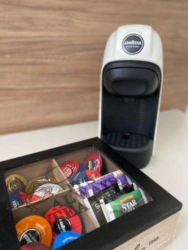 a box with a cell phone sitting next to access at Levante apartment and room in Bari