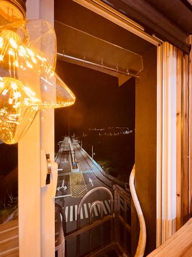 a window with a view of a city at night at Zhiben Wu Jiari in Wenquan
