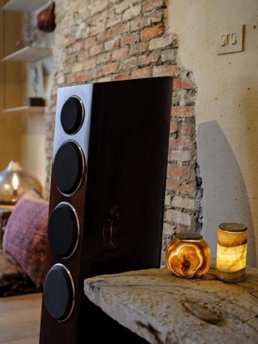 a brick fireplace with a stove in a room at Verne Dreams in Ghent
