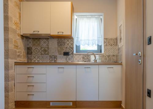 Kuchyňa alebo kuchynka v ubytovaní Sirius luxury Boutique