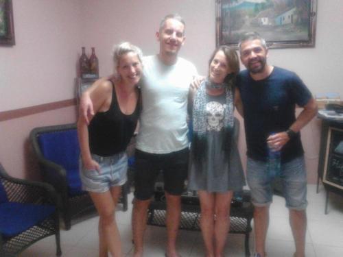 a group of three people posing for a picture at Hospedaje Hefziba in Moyogalpa