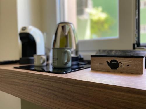 a coffee maker sitting on top of a counter at Levante apartment and room in Bari