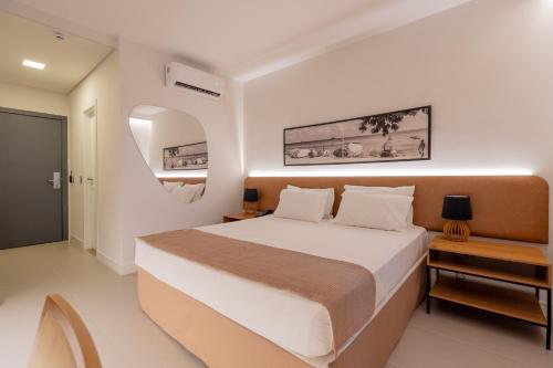 a bedroom with a large bed in a room at Pauli Boutique Hotel in Fortaleza