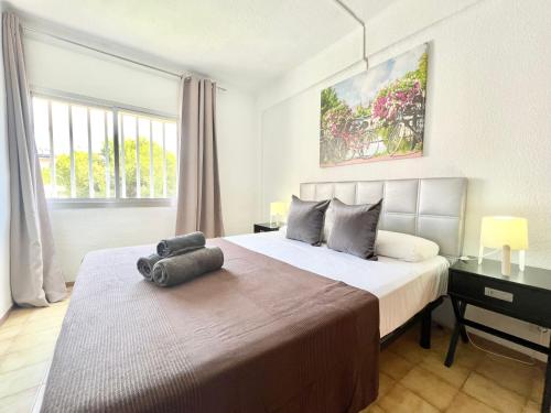 A bed or beds in a room at Apartamentos Zaragoza