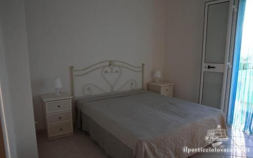 Postel nebo postele na pokoji v ubytování Villa ilporticciolovacanze