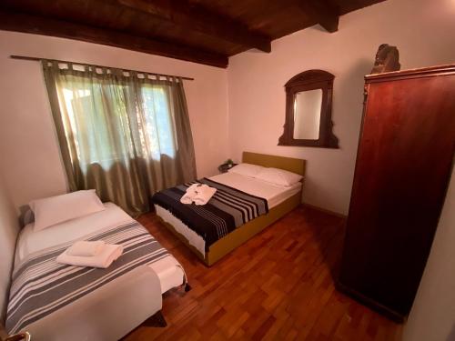 Een bed of bedden in een kamer bij Casa Madre Kravice Waterfalls