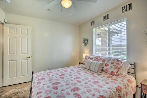 a bedroom with a bed and a window at Sunny Yuma Retreat with Private Pool and Grill! in Yuma