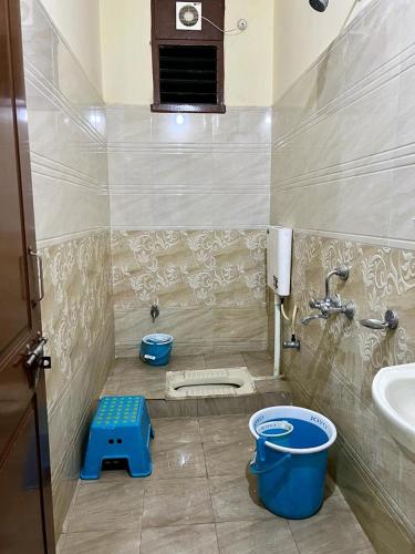 a small bathroom with a sink and a toilet at Home to explore Food, History & Shopping in Hyderabad