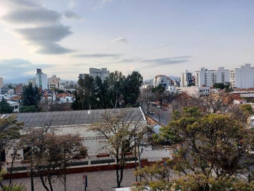 a view of a city with buildings and trees at MIRACERROS Departamento en Salta in Salta