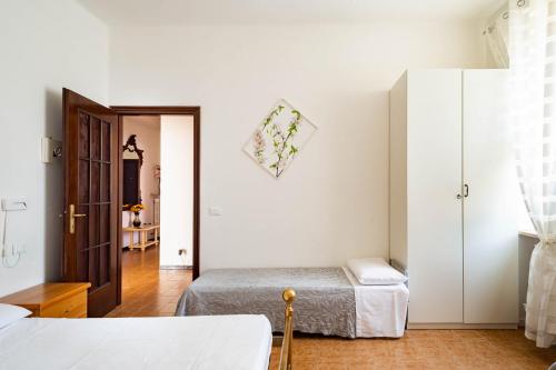 Un pat sau paturi într-o cameră la Casa Magrini