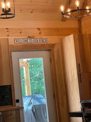 a doorway to our porch in a tiny house at windrock ridge - Ethan in Oak Ridge