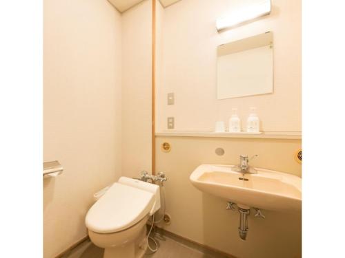 a bathroom with a toilet and a sink at Kasuga no mori - Vacation STAY 80247v in Saku