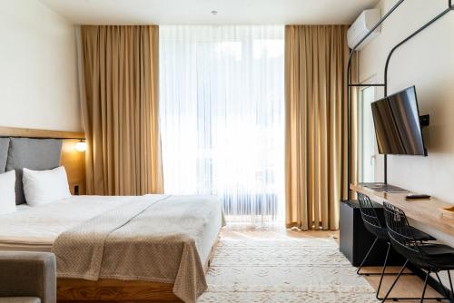 Voodi või voodid majutusasutuse Bukville Hotel & SPA toas