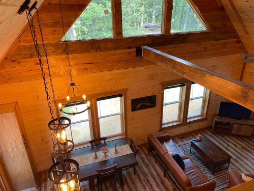 an overhead view of a dining room and living room in a log cabin at windrock ridge - Ethan in Oak Ridge