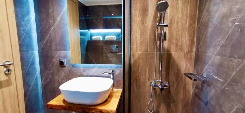 a bathroom with a sink and a shower at Urban Luxus Studio I in Heraklio