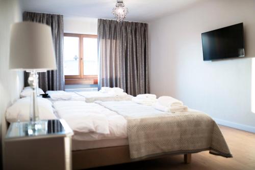 Ένα ή περισσότερα κρεβάτια σε δωμάτιο στο Apartamenty Magia