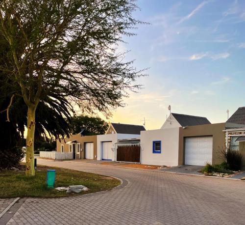 a row of white houses on a street at Self Catering Saldanha House in Saldanha