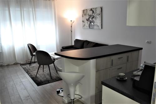 a living room with a table and two chairs at Tiziano T1 in Zagreb