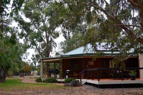 a house with a green roof and a porch at Friends at McLaren Vale in McLaren Vale
