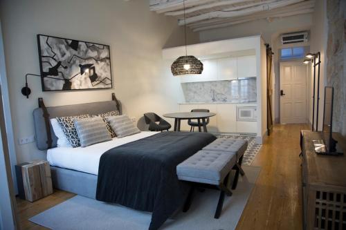 a bedroom with a large bed and a table at TOP Porto in Porto
