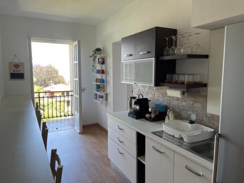 a kitchen with a sink and a counter top at Villa Vittoria in Stresa