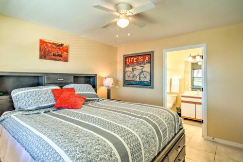 a bedroom with a bed with a ceiling fan at Screened Porch and Pool Access Cozy Sebring Condo in Sebring