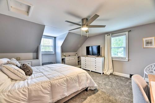 a bedroom with a bed and a ceiling fan at Orchard Park Home Less Than 2 Mi to Highmark Stadium! in Orchard Park