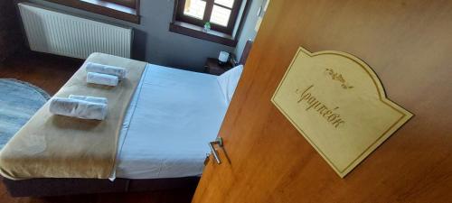 a sign on the door of a hotel room at Soul boutique hotel in Monodendri